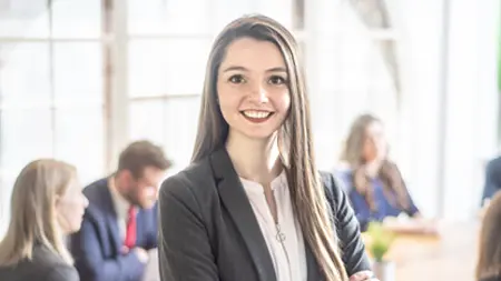 Female business professional among peers.