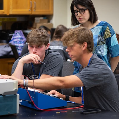 Students in a computer lab working on machines.