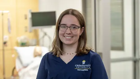 Female nursing student in the simulation lab.