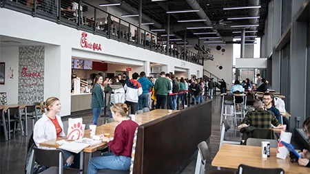 students eating in the chick-fil-a building