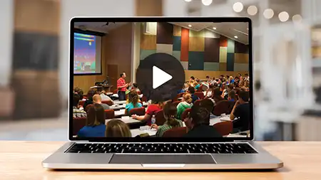 Laptop with video of lecture paused