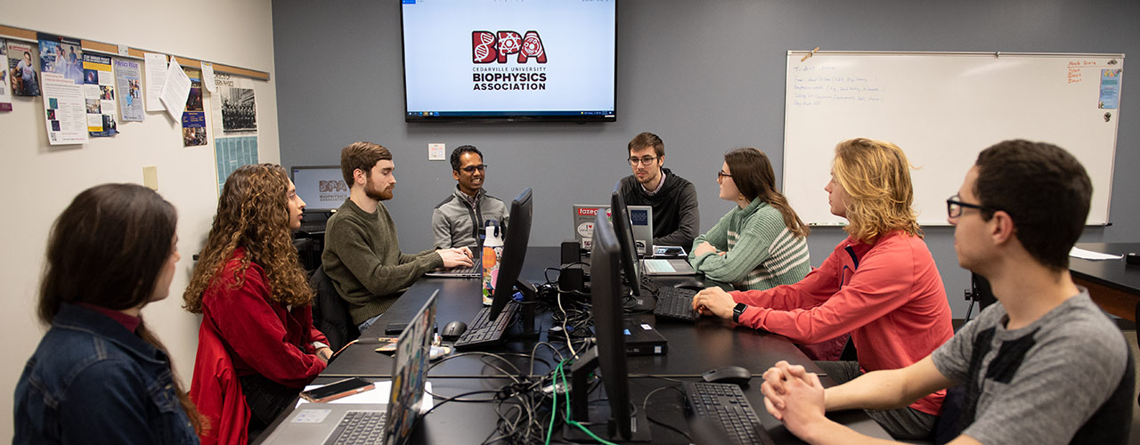Dr. Mohan Pereira meets with members of the Biophysics Association