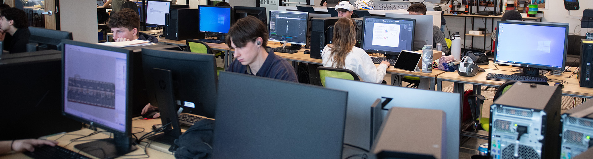 Students working at computer stations.