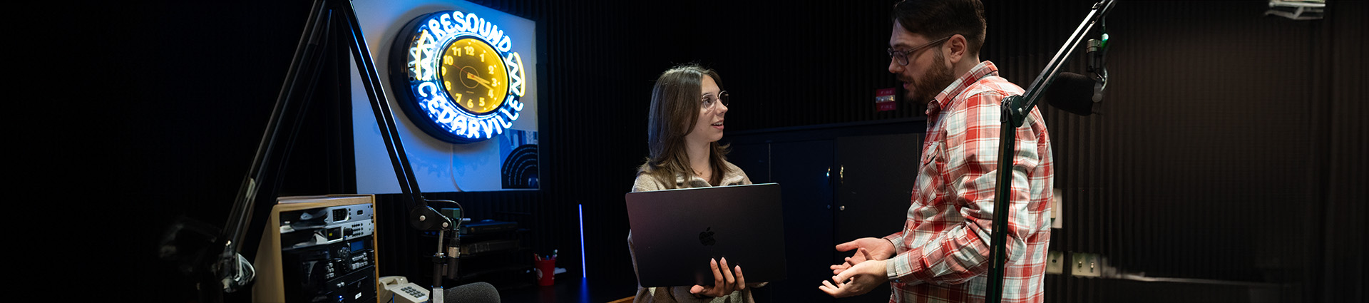 Craig Vinson works with a student at Resound Radio.