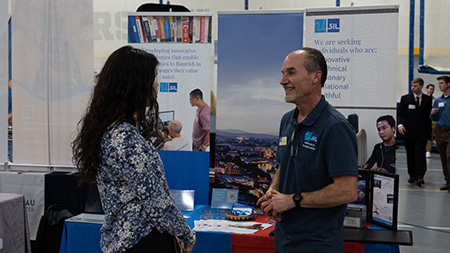 Student talking to employer at the Career Fair