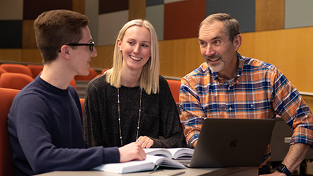 Dr. Miller talking with Bible Students