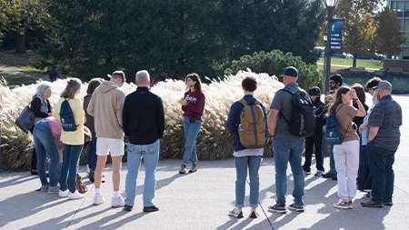 Group of students and families touring campus