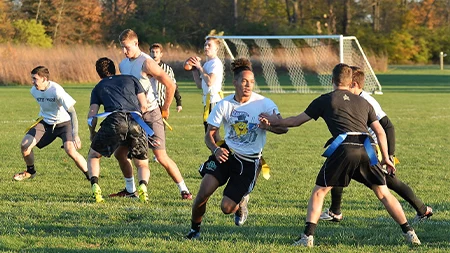 Students playing flag football