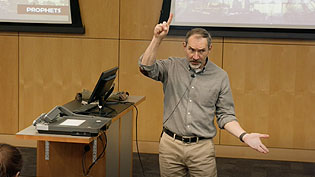 Dr. Miller teaching Old Testament Literature in a lecture hall.