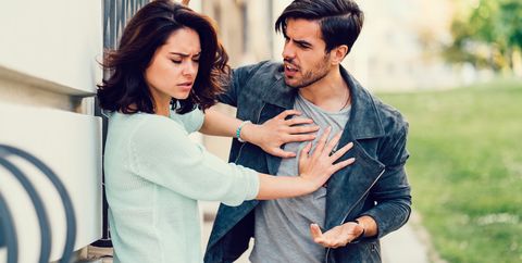 woman pushing man away