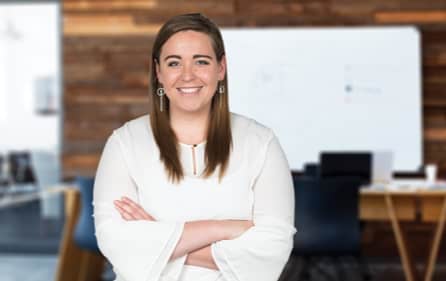 Woman standing in front of whiteboard