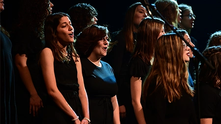Small group from Women's Choir performing onstage