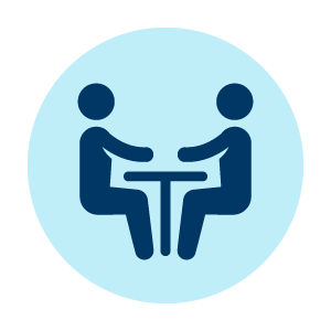 people sitting at table icon